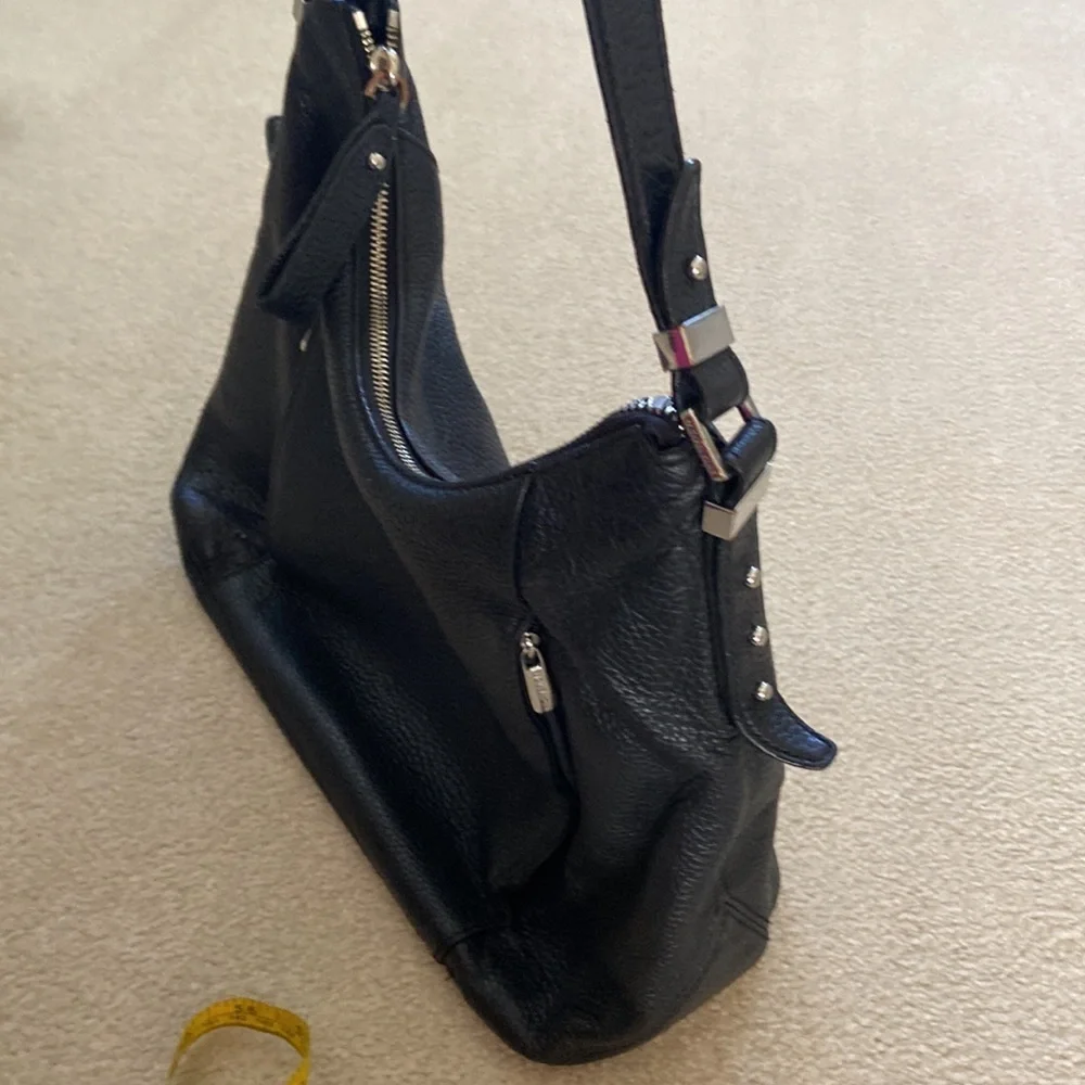 Michael Kors black leather shoulder bag, silver hardware logo on zipper, clean